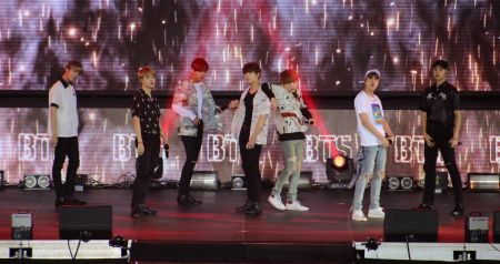 Korean K-Pop supergroup BTS members entertain their fans during their “The Wings Tour” in 2017. Korean K-Pop supergroup BTS members entertain their fans during their “The Wings Tour” in 2017.