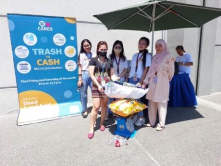 Students drop off their recyclables at the Trash to Cash Recycling Market in SM City Bicutan.