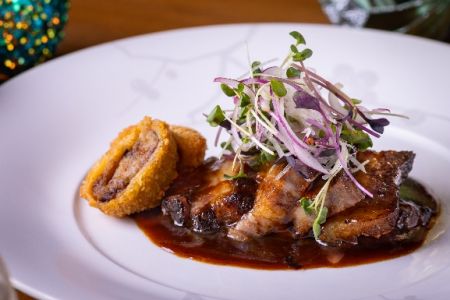 Rich and savory, Nobu’s Wagyu Short Ribs with aka (red) miso sauce, croquettes, micro greens, and red onion is a symphony of flavors and textures.