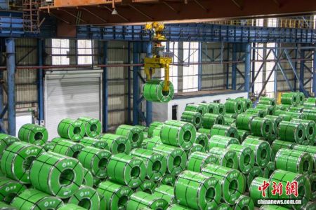 Fully automated production lines run at full capacity to produce steel coils at Guangxi Liuzhou Iron and Steel Group Co., Ltd. Photo by Wei Yuhan