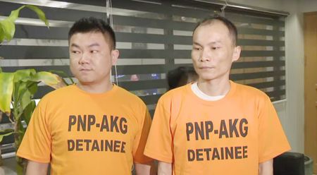 圖為兩名涉嫌綁架同胞而被捕的中國公民。他們被指為高利貸集團成員。
