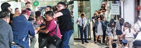 左圖為警方昨日在仙範市青山區商場外制服挾持人質的前保安人員亞齊·巴萊(中)。右圖為安保人員疏散獲救民眾。菲律賓警方2日晚說,當天中午在仙範市發生的劫持人質事件結束,劫持者已向警方投降,約30名人質均安全獲釋。(法新社、新華社)