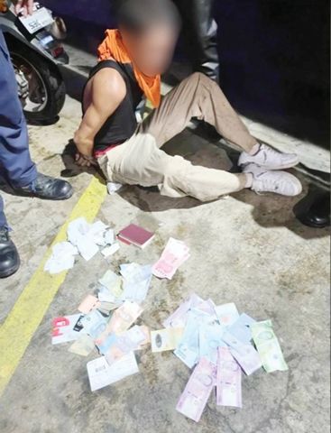 圖為涉嫌在馬加智市搶劫並襲擊中國人家庭的其中一名匪徒被捕。