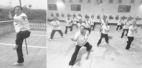 武術家王明欽表演棍術。