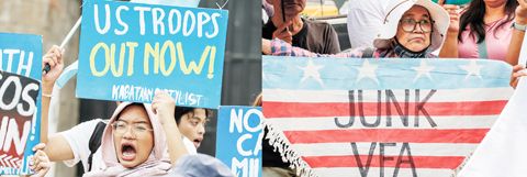 4月20日，民眾手持標語在菲律濱武裝部隊總部外集會抗議。菲律濱和美國「肩並肩」聯合軍事演習20日在菲首都馬尼拉啟動。菲律濱民眾當天在菲武裝部隊總部外集會，抗議菲美舉行聯合軍演。（新華社）